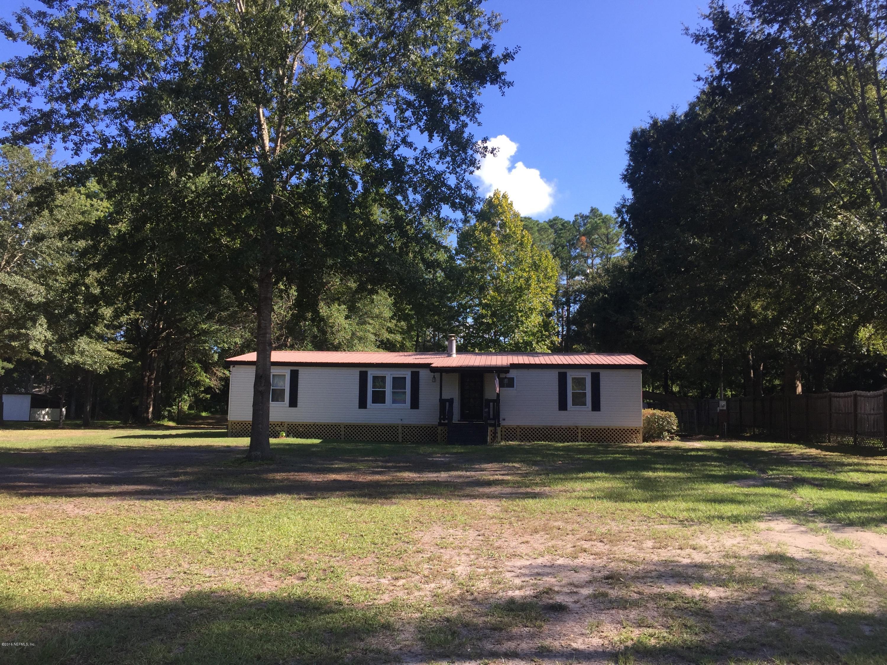 54221 Lawhon Road South Callahan, FL 32011 - Photo 3 of 23 a view of a house with a yard