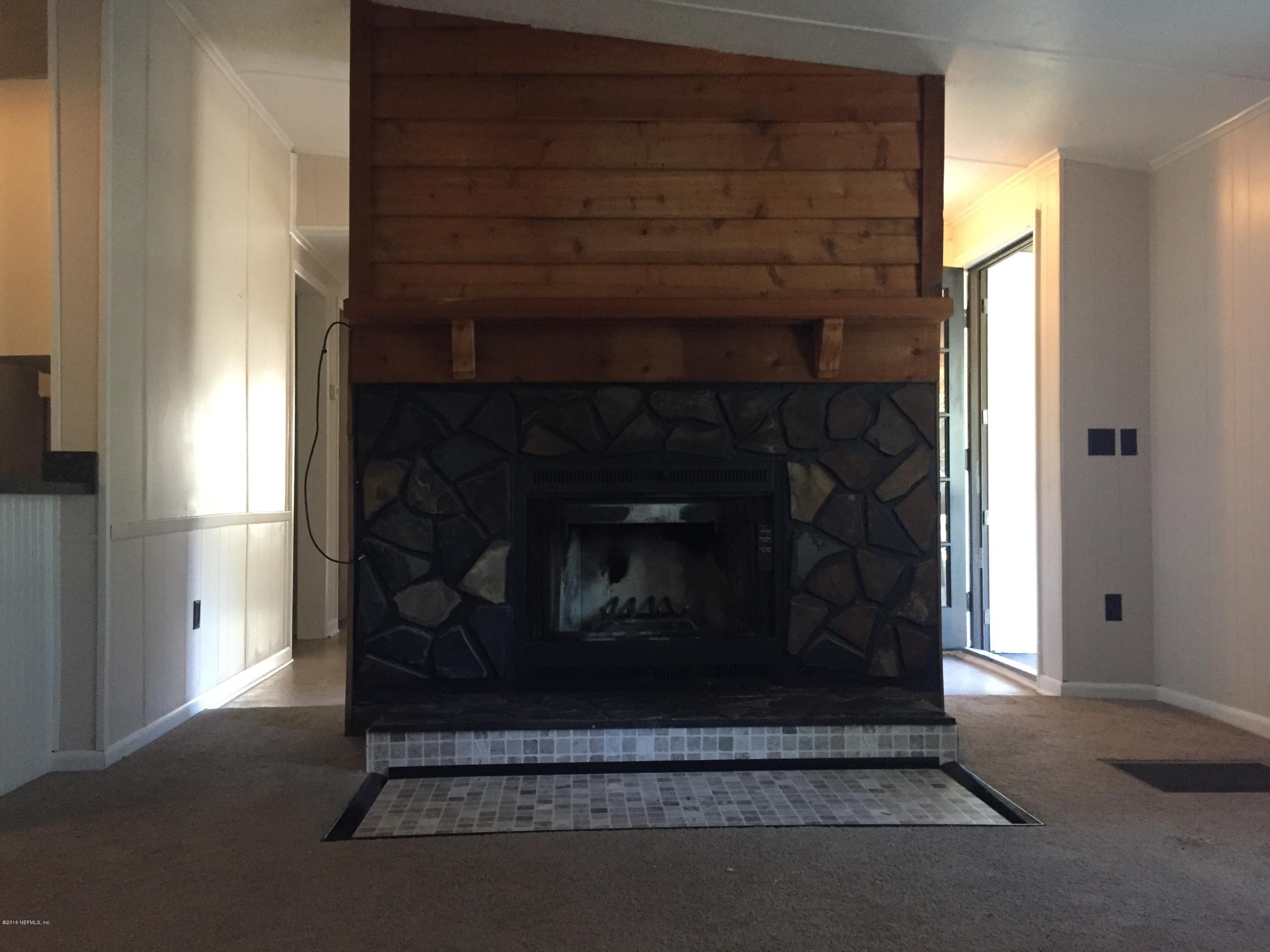54221 Lawhon Road South Callahan, FL 32011 - Photo 9 of 23 a living room with a fireplace