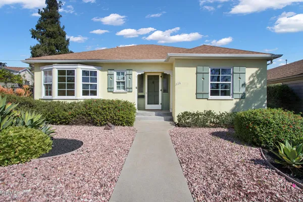 front view of a house with a yard
