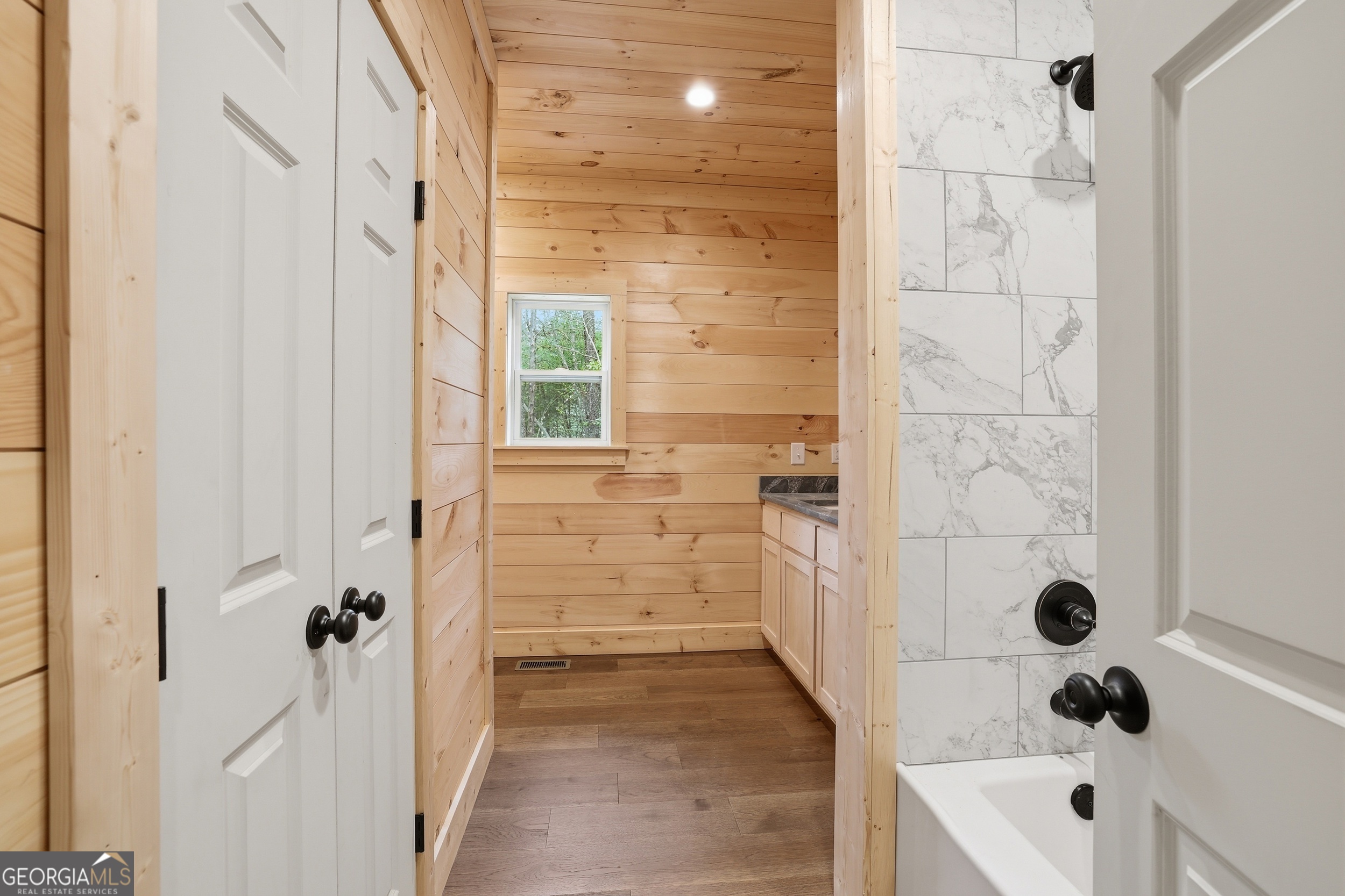 74 Blanche Place Road Clayton, GA 30525 - Photo 15 of 42 a bathroom with a tub sink and shower