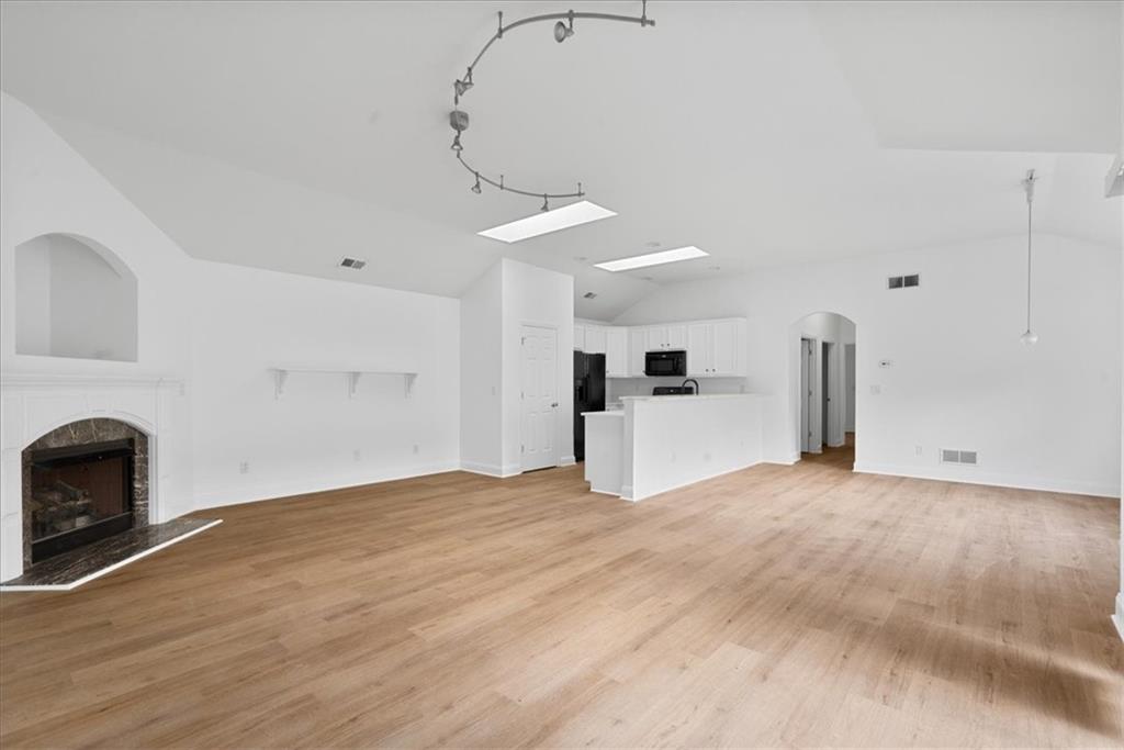 156 Cottage Club Drive Locust Grove, GA 30248 - Photo 11 of 34 a view of empty room with a fireplace