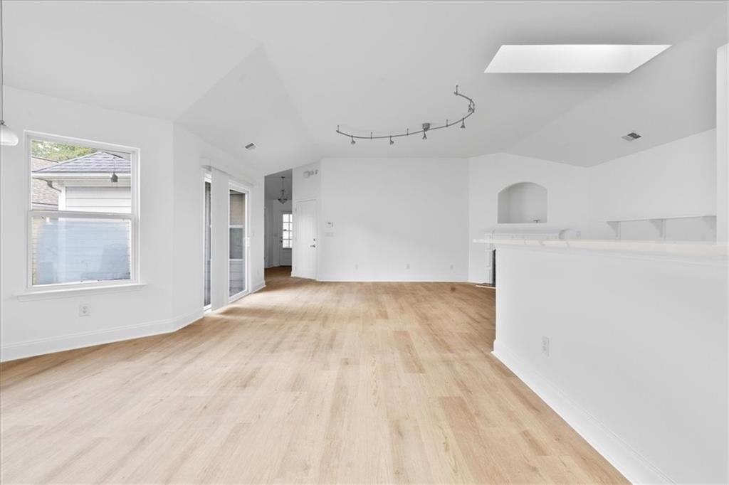 156 Cottage Club Drive Locust Grove, GA 30248 - Photo 15 of 34 a view of empty room with cabinet and window