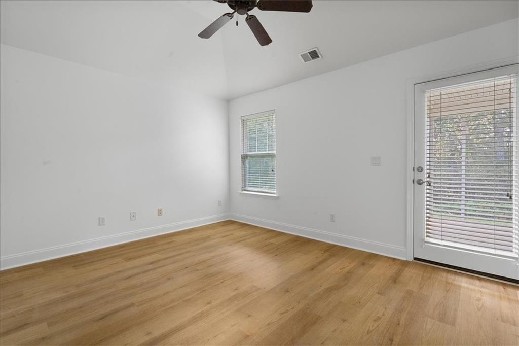 156 Cottage Club Drive Locust Grove, GA 30248 - Photo 18 of 34 a view of an empty room with a window