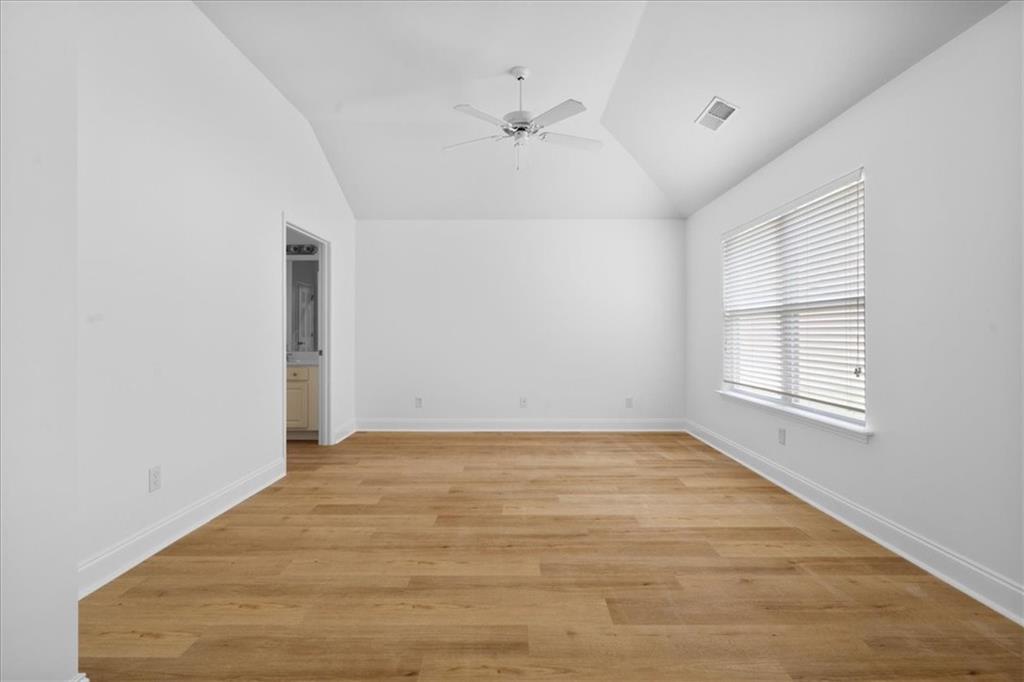 156 Cottage Club Drive Locust Grove, GA 30248 - Photo 20 of 34 a view of an empty room with a window