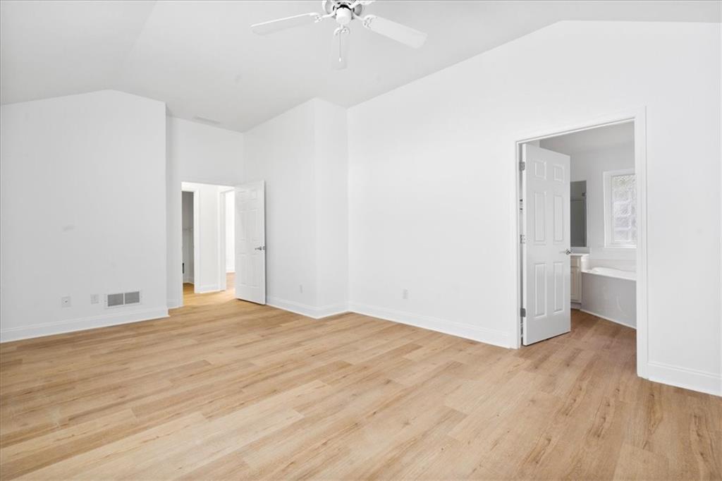156 Cottage Club Drive Locust Grove, GA 30248 - Photo 21 of 34 a view of empty room with wooden floor