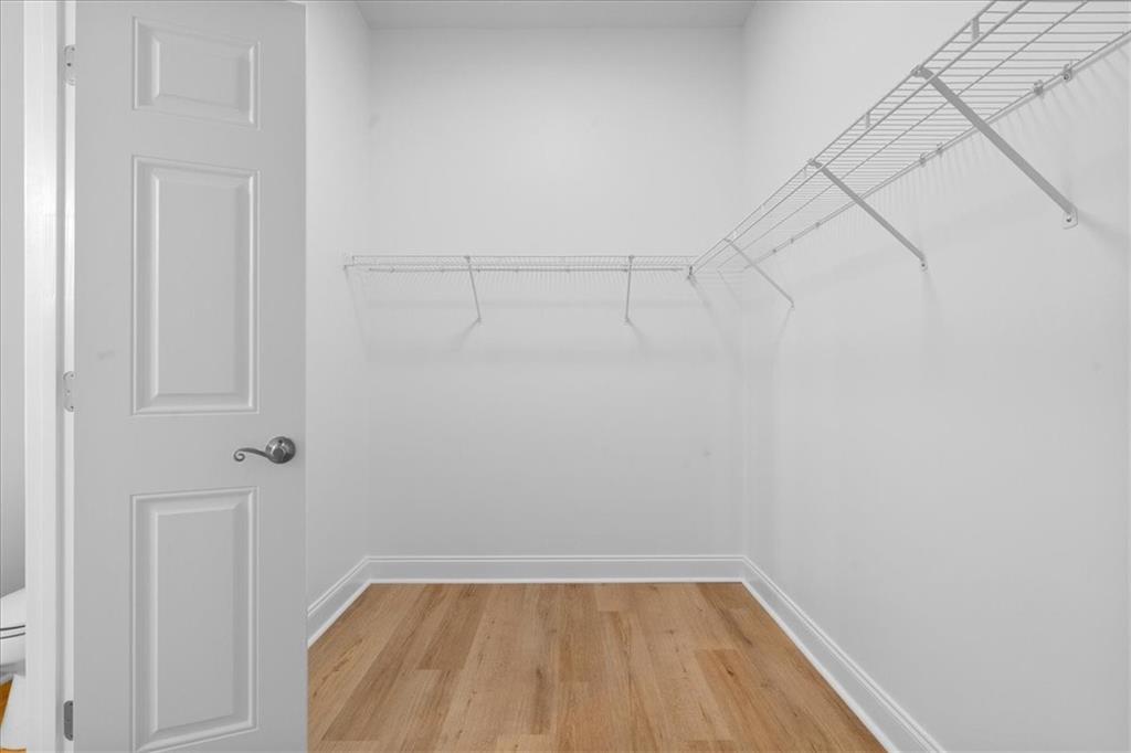 156 Cottage Club Drive Locust Grove, GA 30248 - Photo 25 of 34 a view of a room with racks on the wall