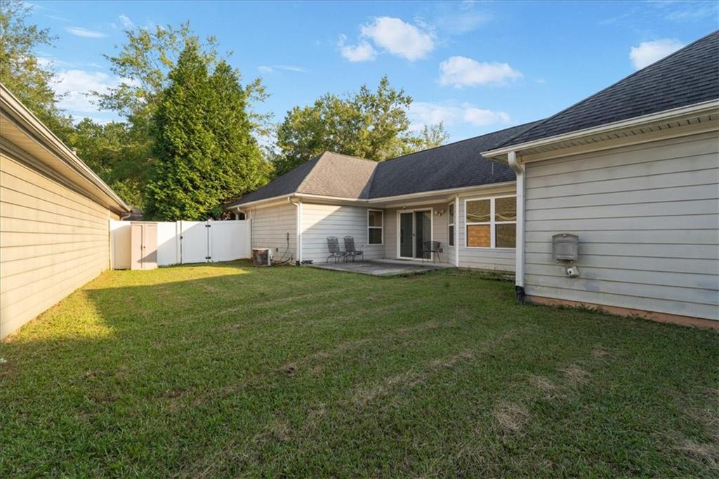 156 Cottage Club Drive Locust Grove, GA 30248 - Photo 29 of 34 a house view with a garden space