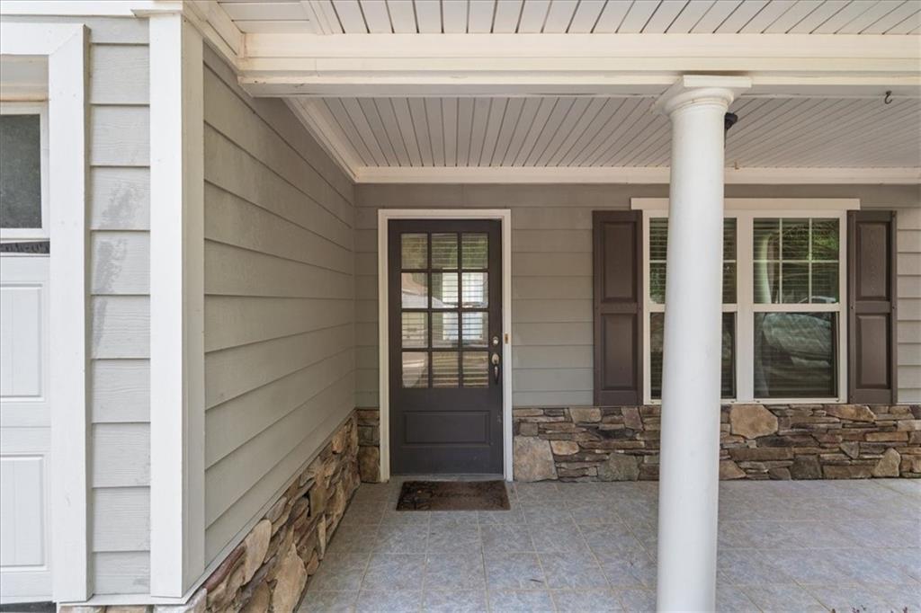 156 Cottage Club Drive Locust Grove, GA 30248 - Photo 30 of 34 front view of a house with glass door