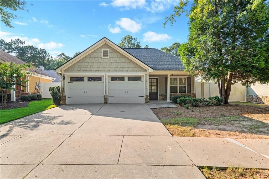 156 Cottage Club Drive Locust Grove, GA 30248 - Photo 3 of 34 a view of a house with a yard