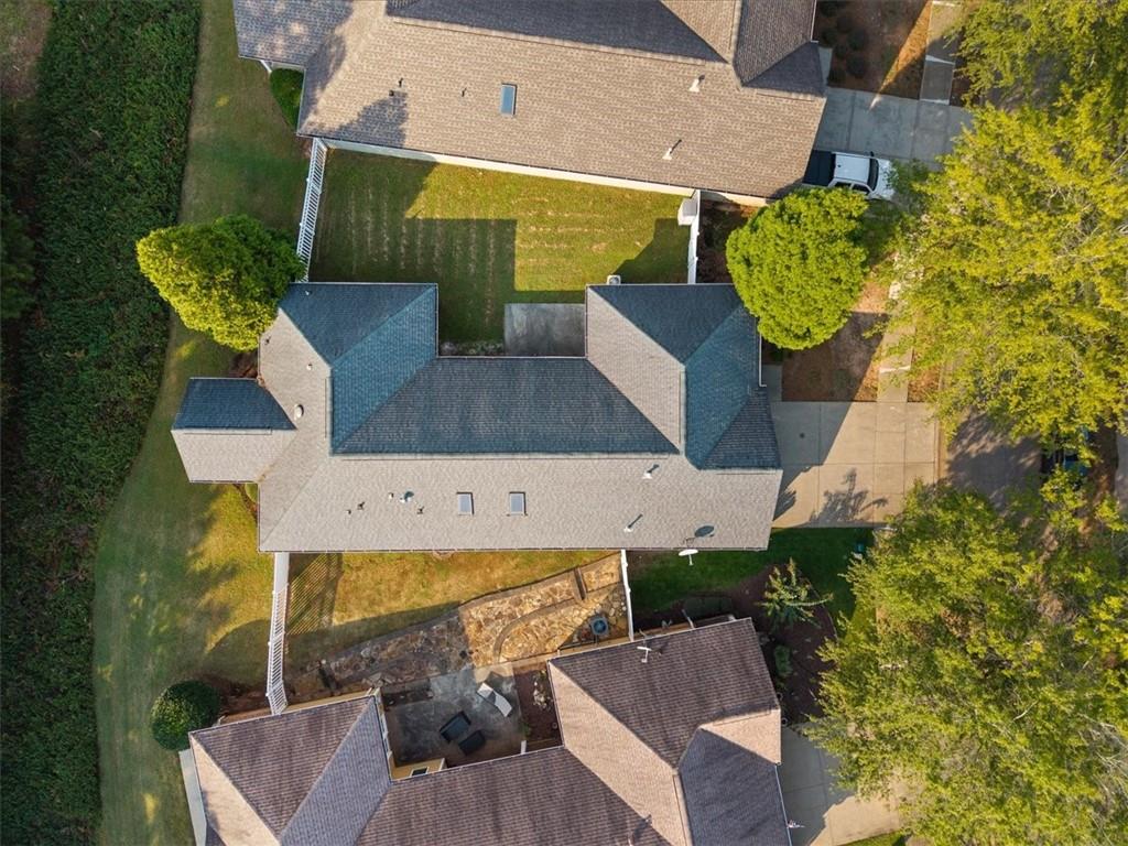 156 Cottage Club Drive Locust Grove, GA 30248 - Photo 31 of 34 an aerial view of a house with garden space and seating area