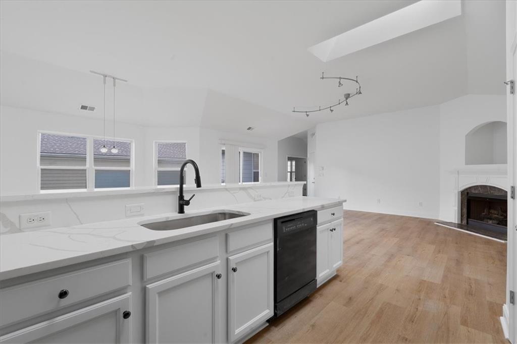 156 Cottage Club Drive Locust Grove, GA 30248 - Photo 5 of 34 a kitchen with a sink and cabinets