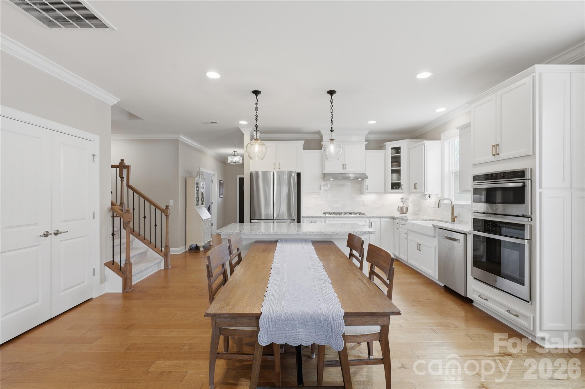 3023 Eagle Ridge Lane Indian Trail, NC 28079 - Photo 14 of 47 a large kitchen with a table and chairs in it