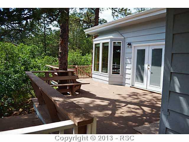 960 Hidden Valley Road Colorado Springs, CO 80919 - Photo 15 of 21 Deck wraps around the family room.