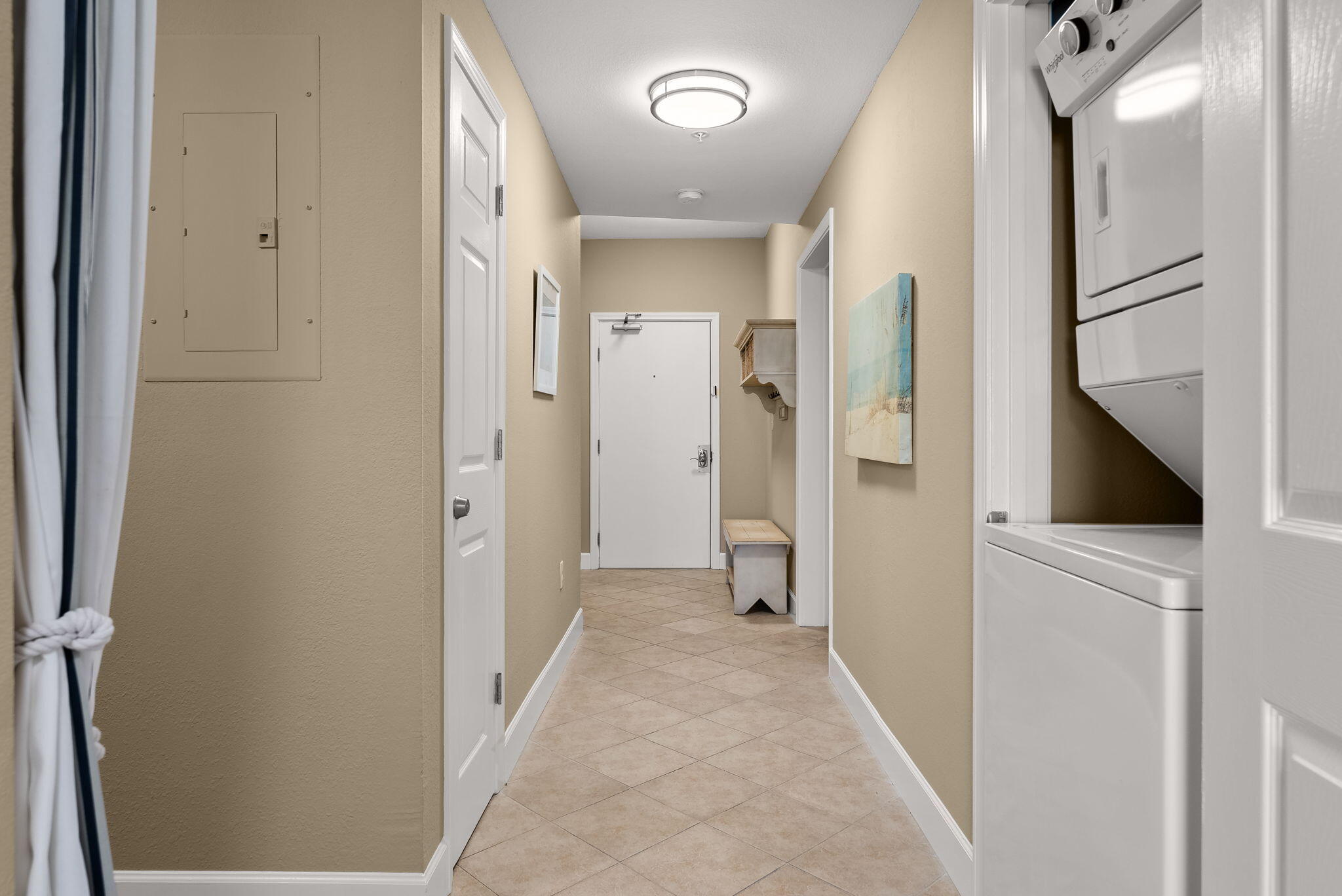 16819 Front Beach Road, Unit 411 Panama City Beach, FL 32413 - Photo 12 of 44 a view of a hallway with wooden floor and a bathroom