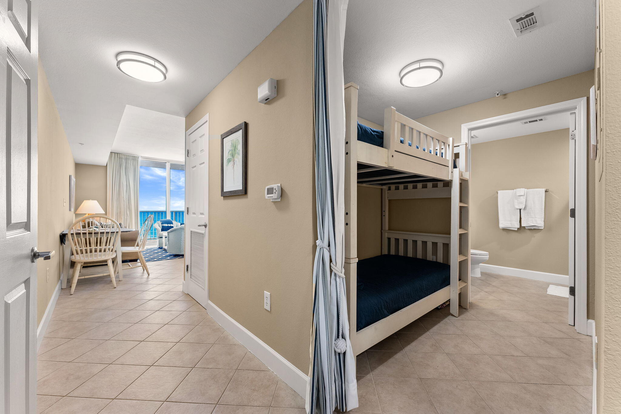 16819 Front Beach Road, Unit 411 Panama City Beach, FL 32413 - Photo 21 of 44 a view of a bedroom with furniture and window