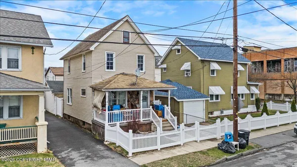 a white building that has a clock on it