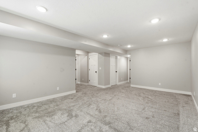 338 Windy Rdg Drive Smithfield, UT 84335 - Photo 42 of 63 Open room featuring recessed lighting, light gray wall paint, white baseboards, and gray carpeting
