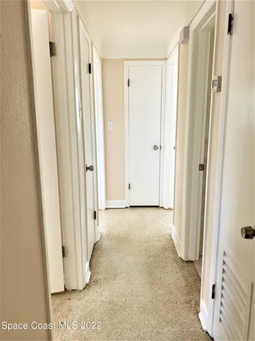 a view of a bathroom with wooden floor