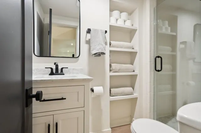 a room with a table chairs and a wooden floor