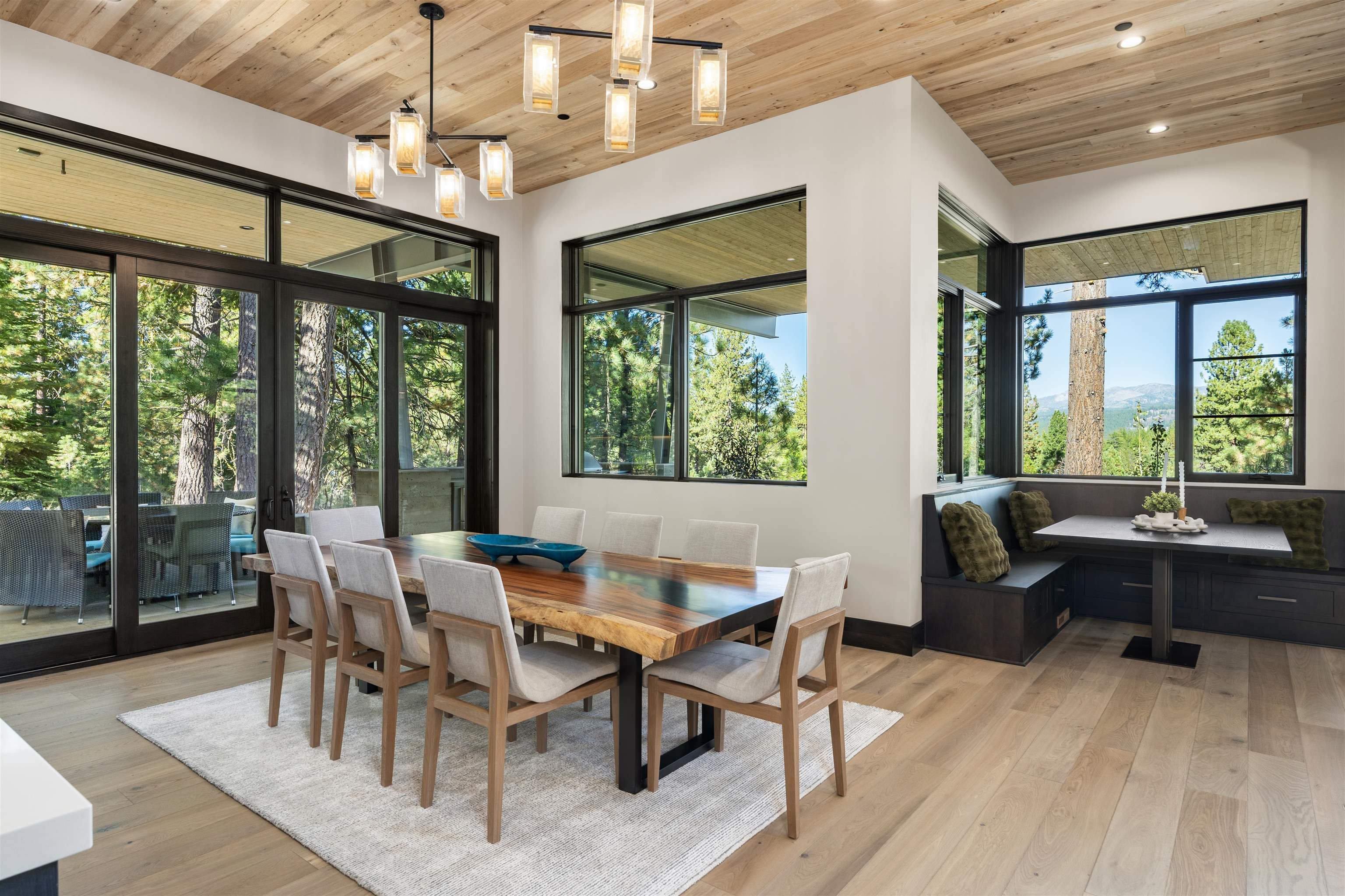 130 James Reed Truckee, CA 96161 - Photo 11 of 28 a view of a dining room with furniture large windows and wooden floor