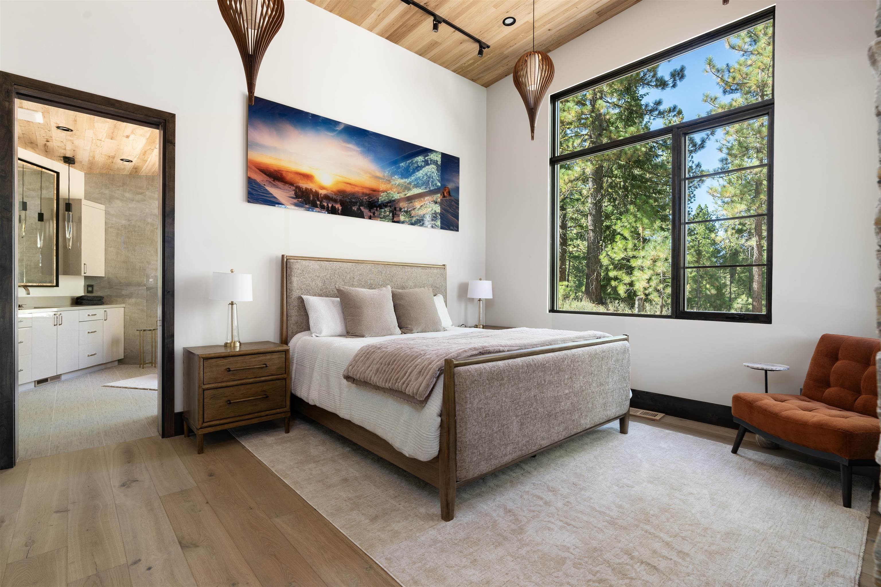 130 James Reed Truckee, CA 96161 - Photo 14 of 28 a spacious bedroom with a bed and a couch
