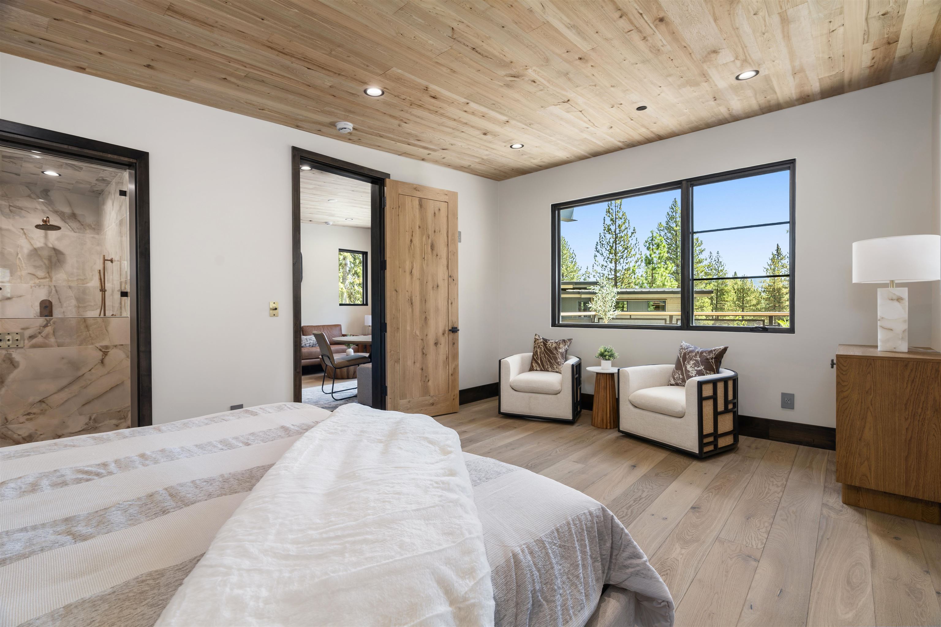 130 James Reed Truckee, CA 96161 - Photo 19 of 28 a spacious bedroom with a bed and wooden floor