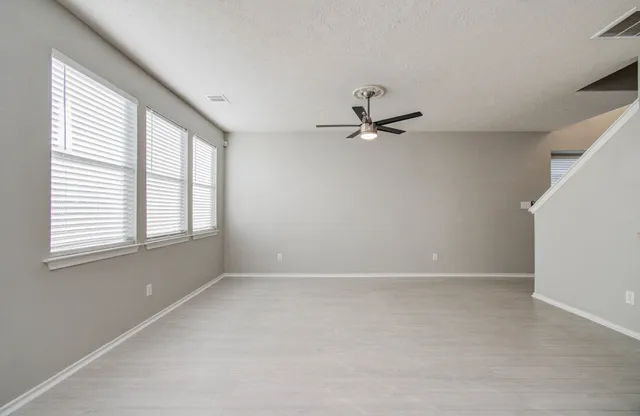 a view of an empty room and window