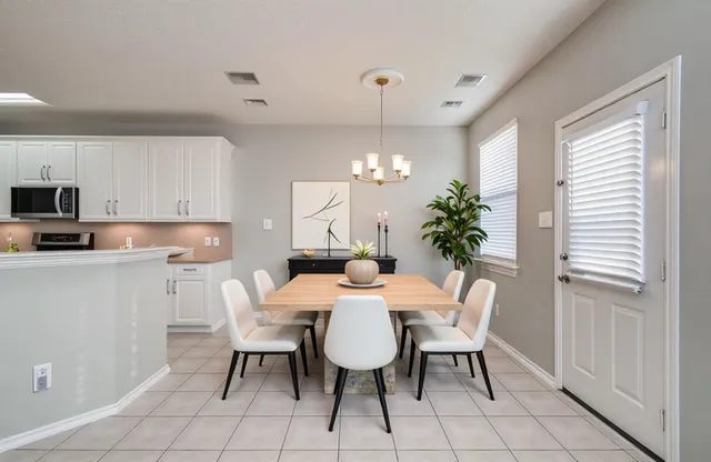a white bath tub sitting next to a shower