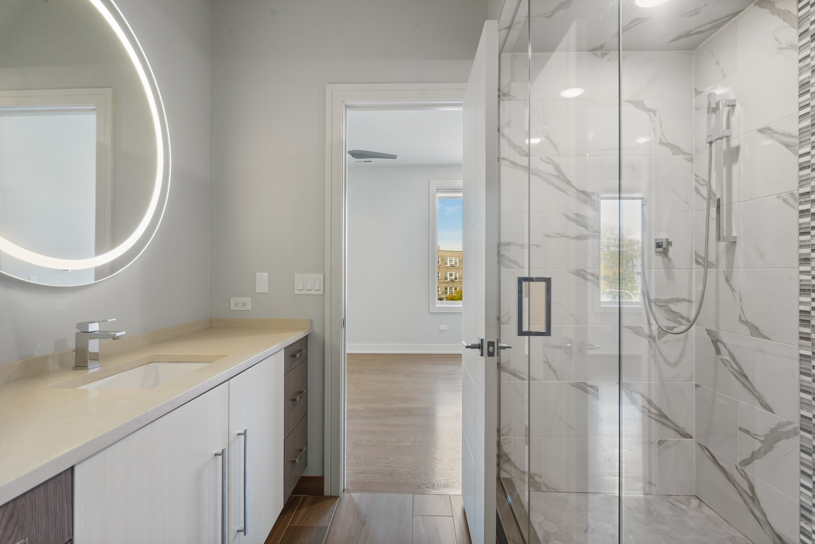 2352 West Winona Street, Unit 2W Chicago, IL 60625 - Photo 15 of 22 a bathroom with a sink a toilet and shower