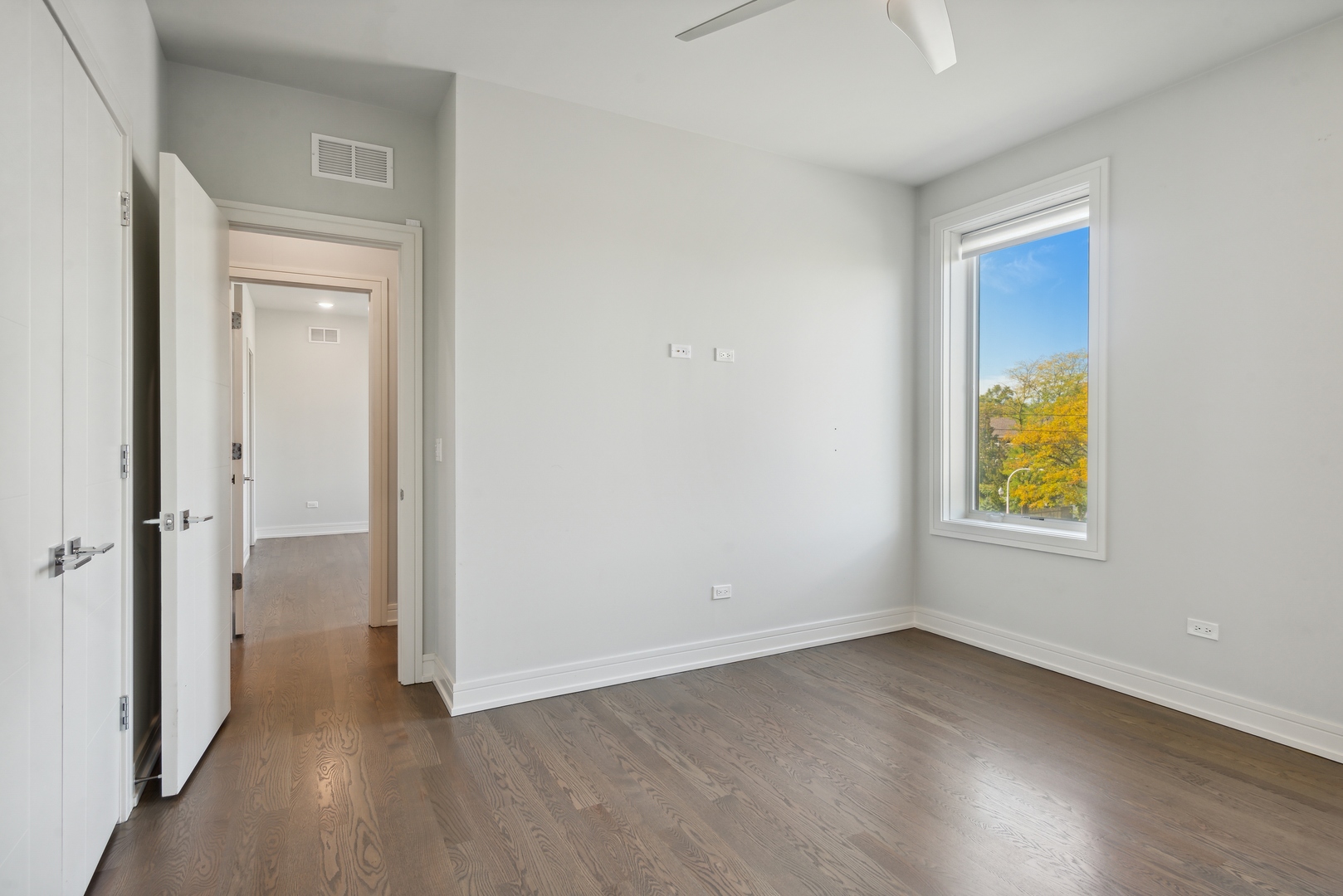 2352 West Winona Street, Unit 2W Chicago, IL 60625 - Photo 16 of 22 a view of an empty room and window