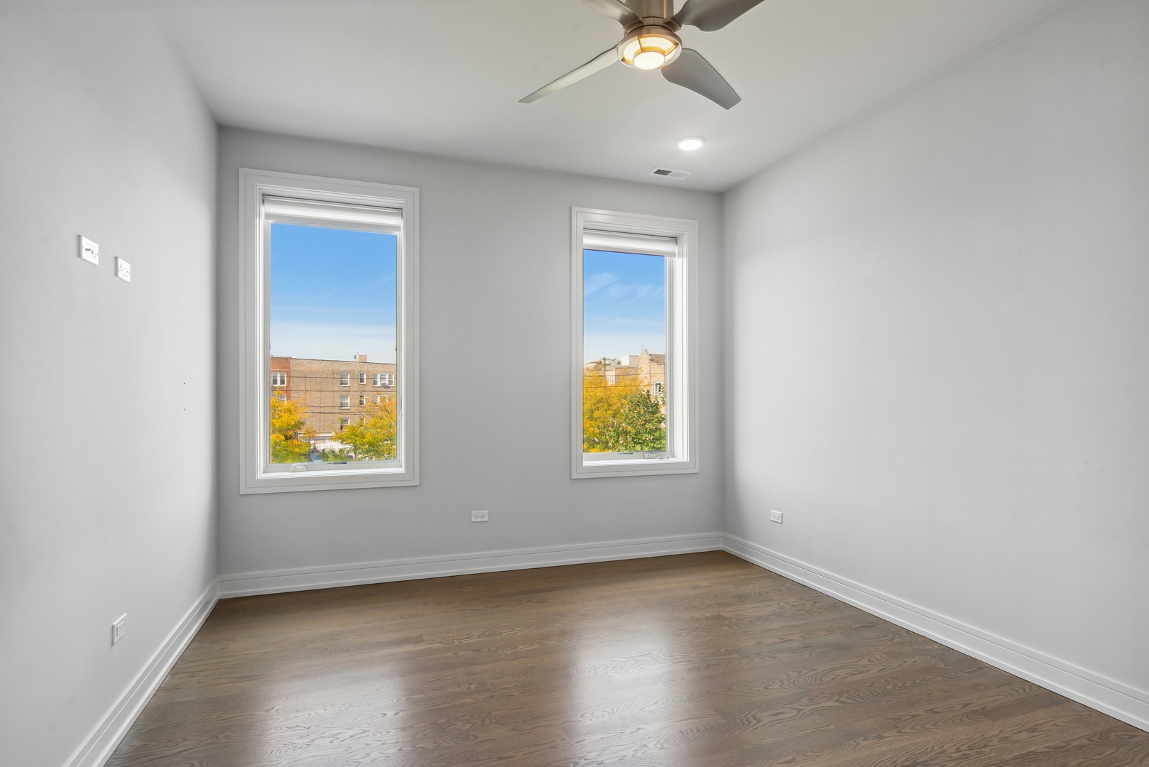2352 West Winona Street, Unit 2W Chicago, IL 60625 - Photo 17 of 22 an empty room with window and wooden floor