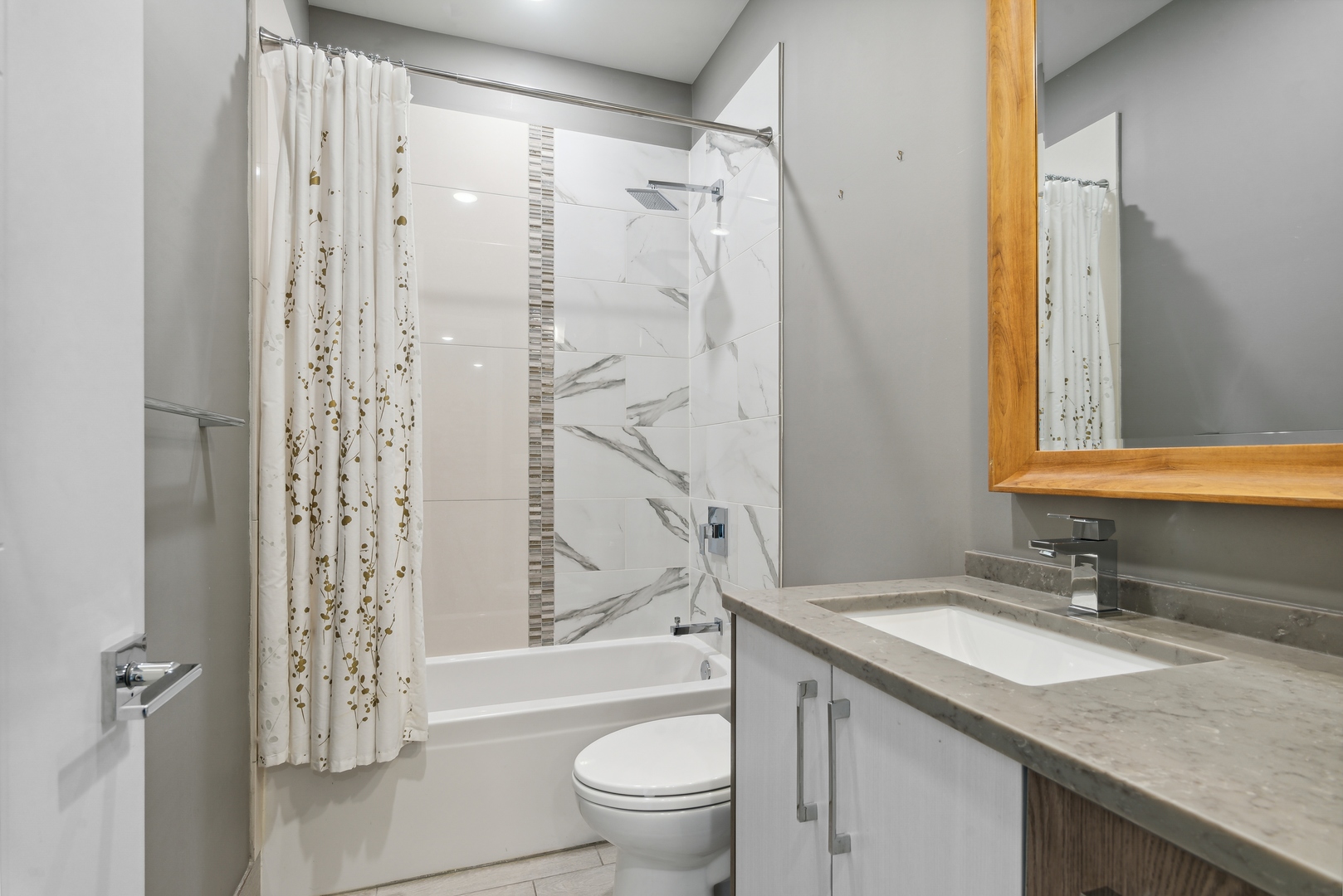 2352 West Winona Street, Unit 2W Chicago, IL 60625 - Photo 18 of 22 a bathroom with a granite countertop sink toilet and shower