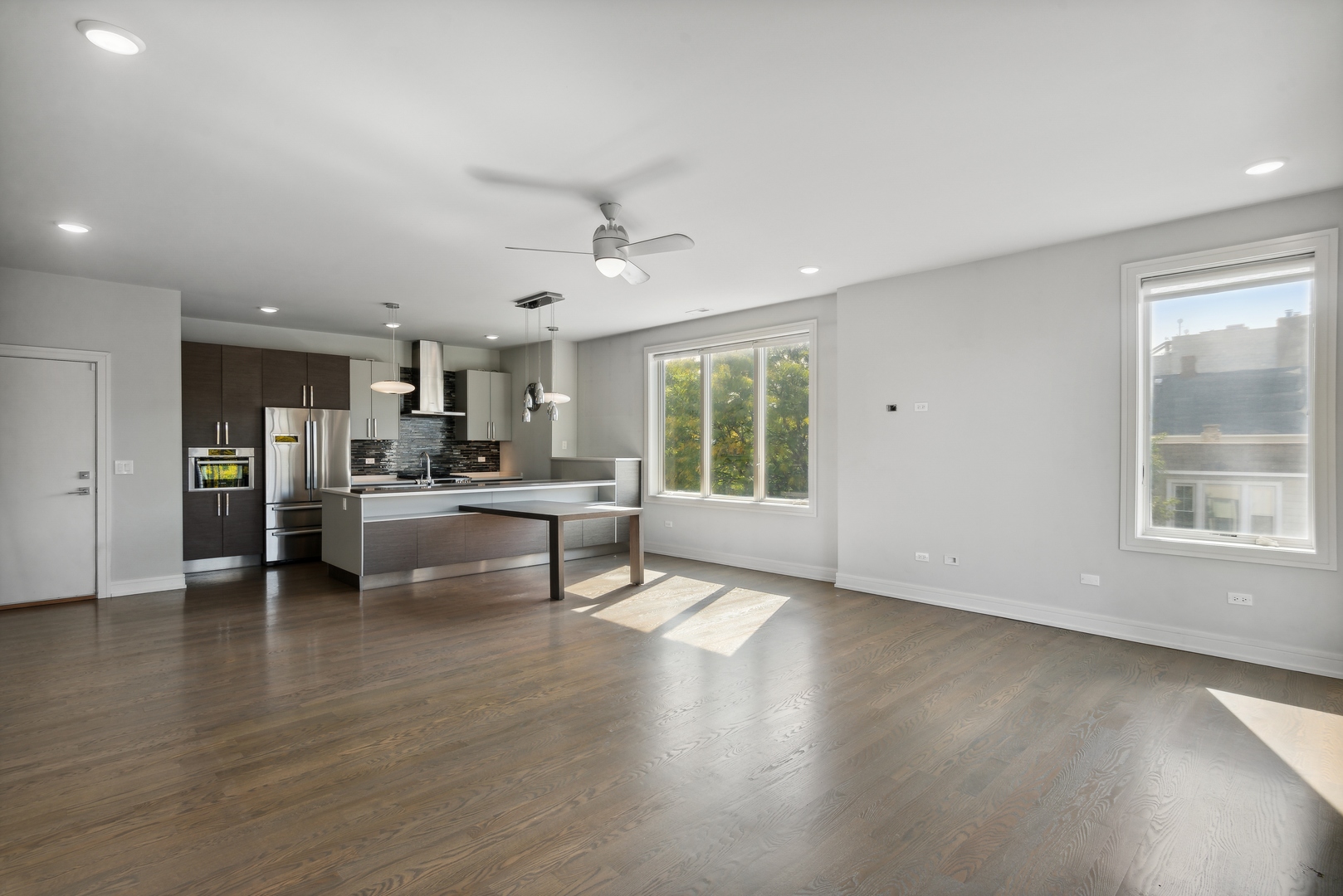 2352 West Winona Street, Unit 2W Chicago, IL 60625 - Photo 4 of 22 a living room with furniture and kitchen view