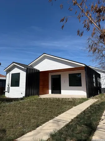 a front view of a house with garage