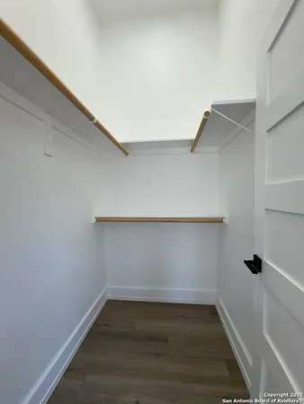 a view of an empty walk in closet