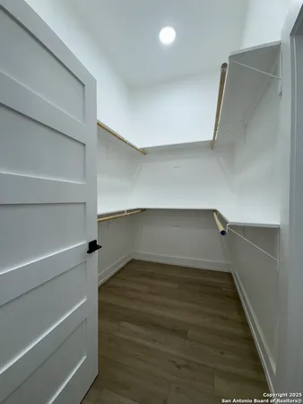 a view of an empty walk in closet