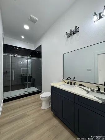 a bathroom with a sink and mirror