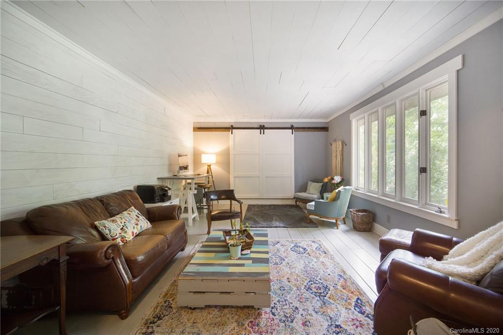 3927 Rounding Run Road Charlotte, NC 28277 - Photo 21 of 48 a living room with furniture and a large window