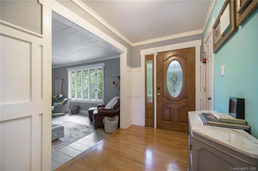 3927 Rounding Run Road Charlotte, NC 28277 - Photo 22 of 48 a living room with furniture a mirror and a fireplace