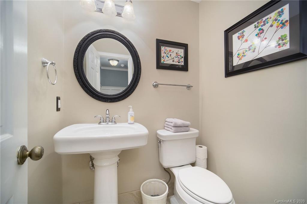 3927 Rounding Run Road Charlotte, NC 28277 - Photo 26 of 48 a bathroom with a toilet sink and mirror