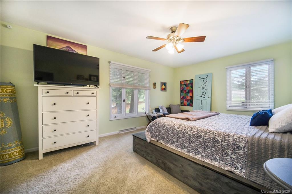 3927 Rounding Run Road Charlotte, NC 28277 - Photo 30 of 48 a bedroom with a bed and flat screen tv