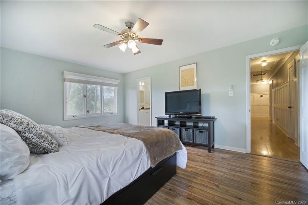3927 Rounding Run Road Charlotte, NC 28277 - Photo 33 of 48 a bedroom with a bed and a flat screen tv