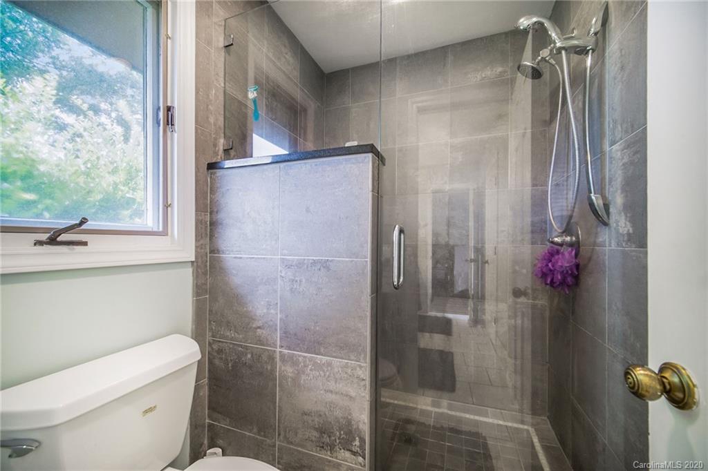 3927 Rounding Run Road Charlotte, NC 28277 - Photo 35 of 48 a bathroom with a shower and toilet
