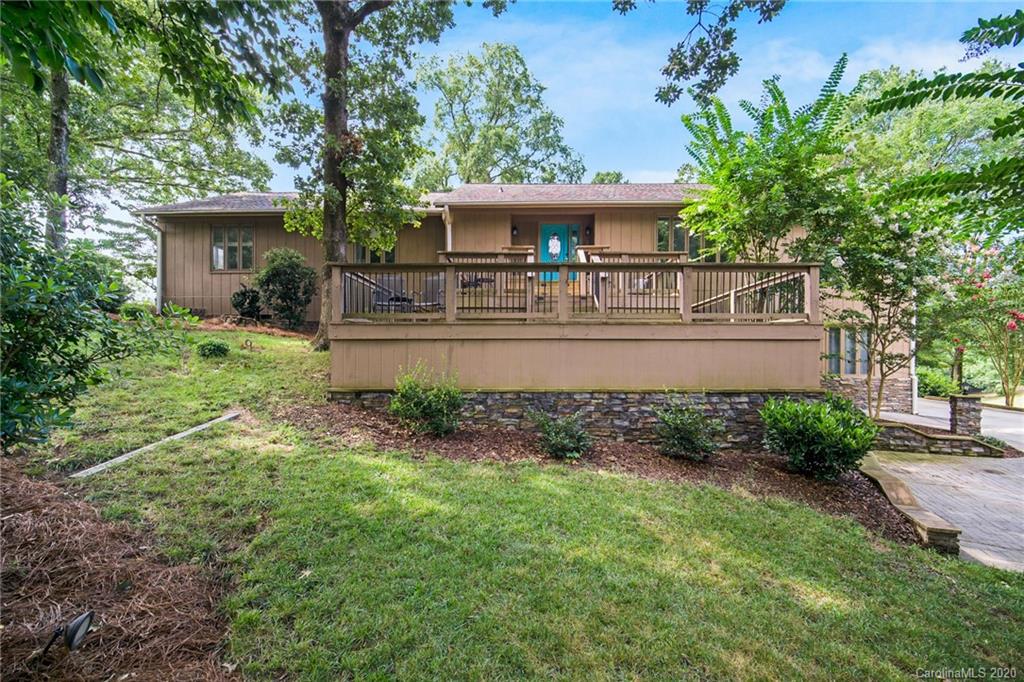 3927 Rounding Run Road Charlotte, NC 28277 - Photo 5 of 48 a front view of a house with garden