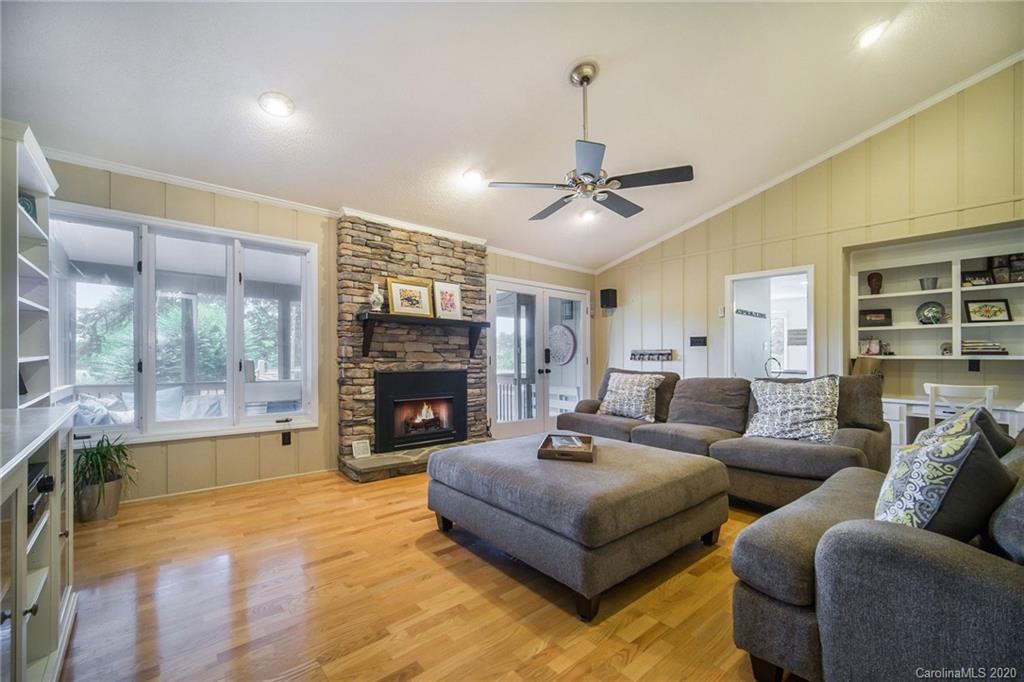 3927 Rounding Run Road Charlotte, NC 28277 - Photo 8 of 48 a living room with furniture and a fireplace