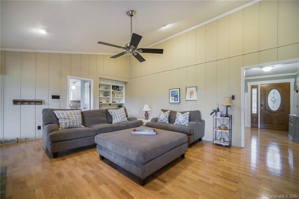 3927 Rounding Run Road Charlotte, NC 28277 - Photo 9 of 48 a living room with furniture and a wooden floor