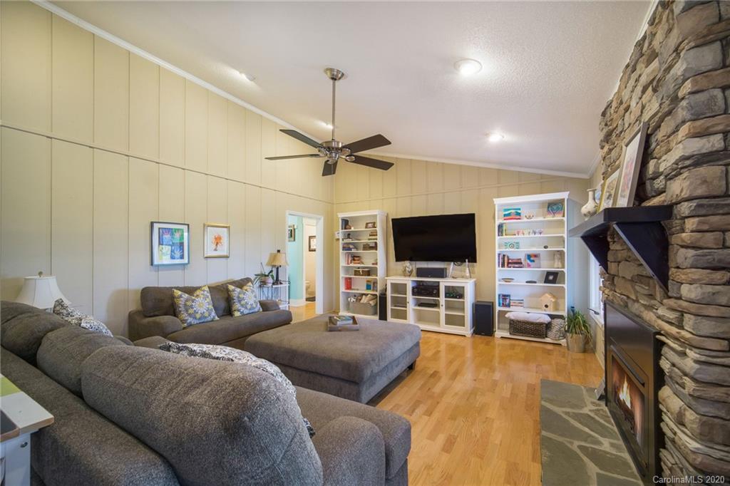 3927 Rounding Run Road Charlotte, NC 28277 - Photo 10 of 48 a living room with furniture and a flat screen tv