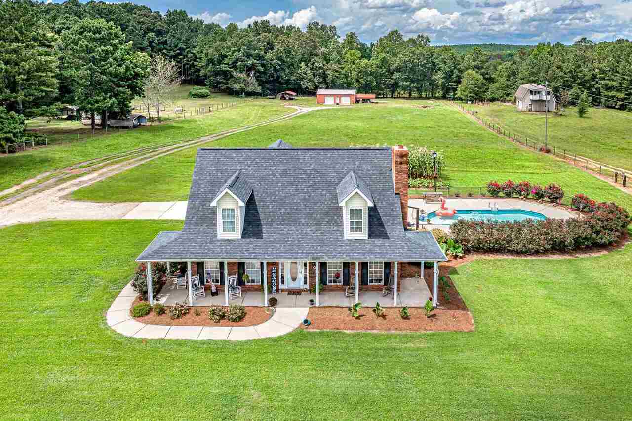 147 Old S River Road Jackson, GA 30233 - Photo 1 of 1 a aerial view of a house with a yard table and chairs