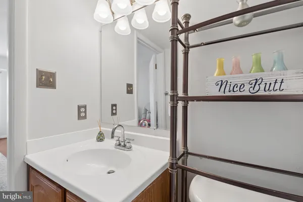 a bathroom with a sink a mirror and a shower