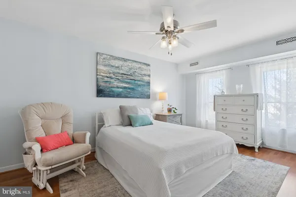 a bedroom with a bed and a couch